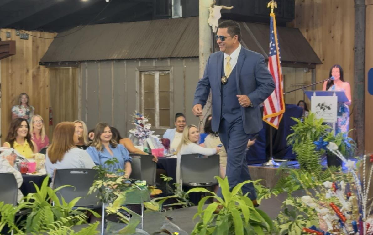 SBSO COL. CHAD CLARK WALKS IN BPW FASHION SHOW
   
Col. Chad Clark, commander of the Criminal Inves