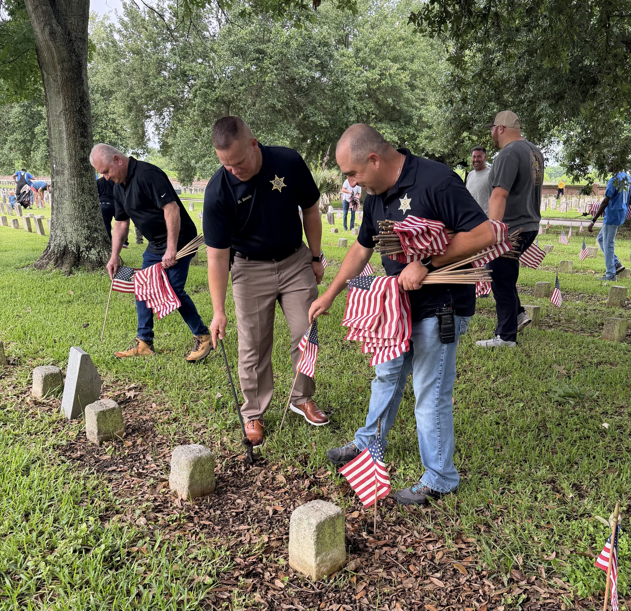 SBSO HELPS PLACE FLAGS AT CHALMETTE NATIONAL CEMETERY FOR MEMORIAL DAY   

A group of deputies with